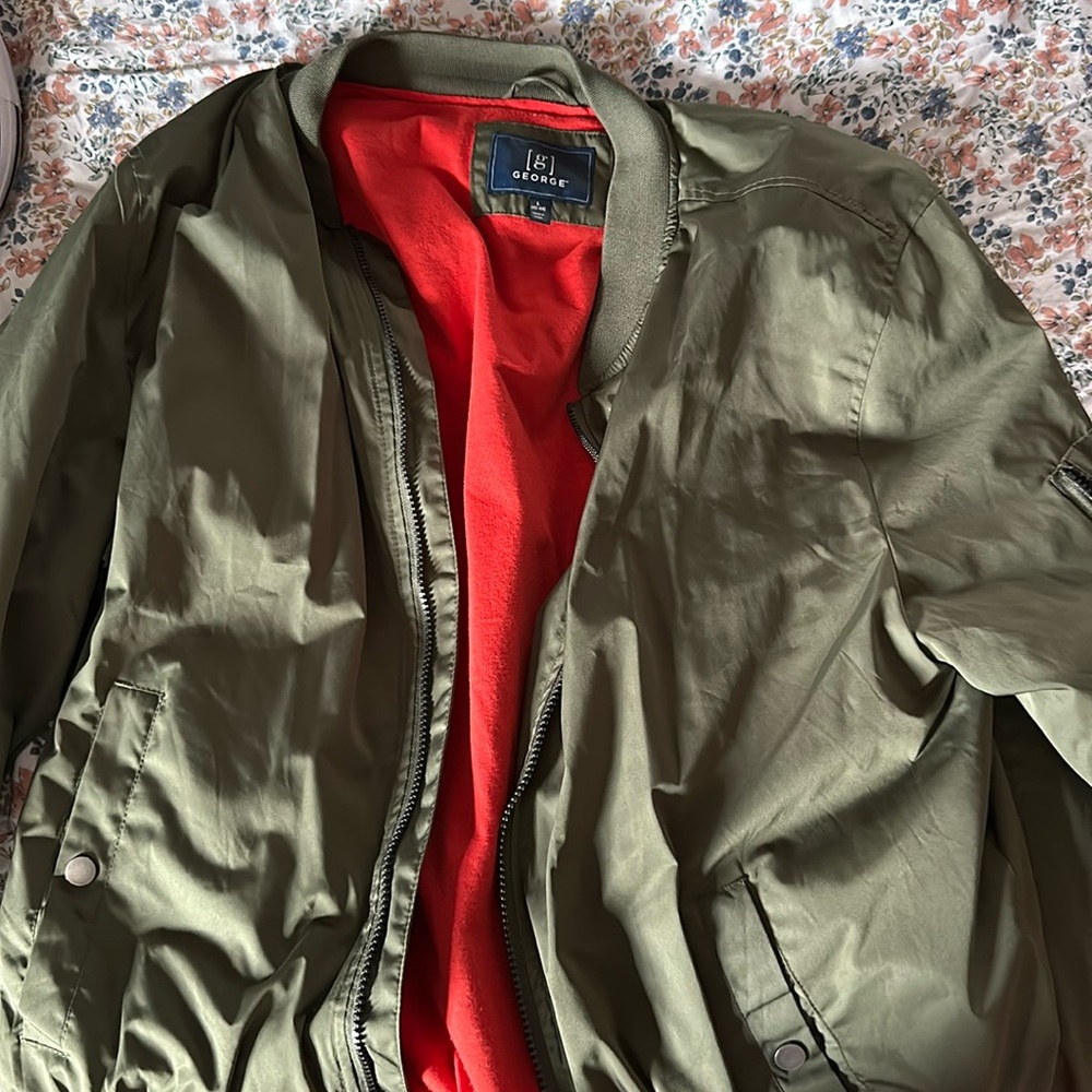 Army green bomber jacket with reddish orange lining